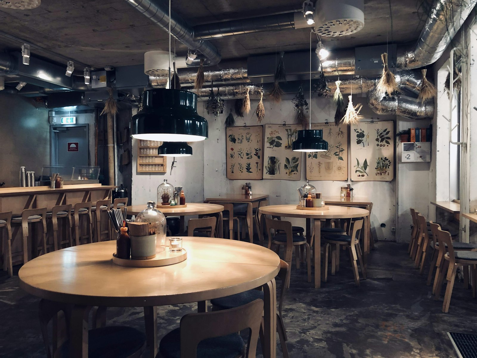 The back room at ConnectionCafe.com set with long tables and warm lighting for a private group booking