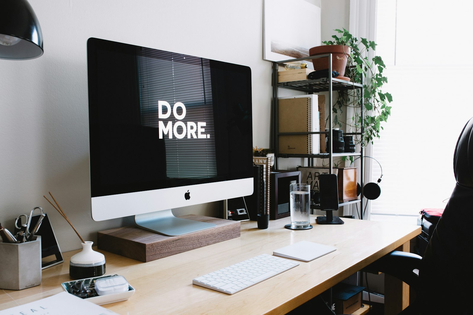 A tidy home desk with a computer, keyboard and plants — the kind of everyday set-up ConnectionCafe.com writes about