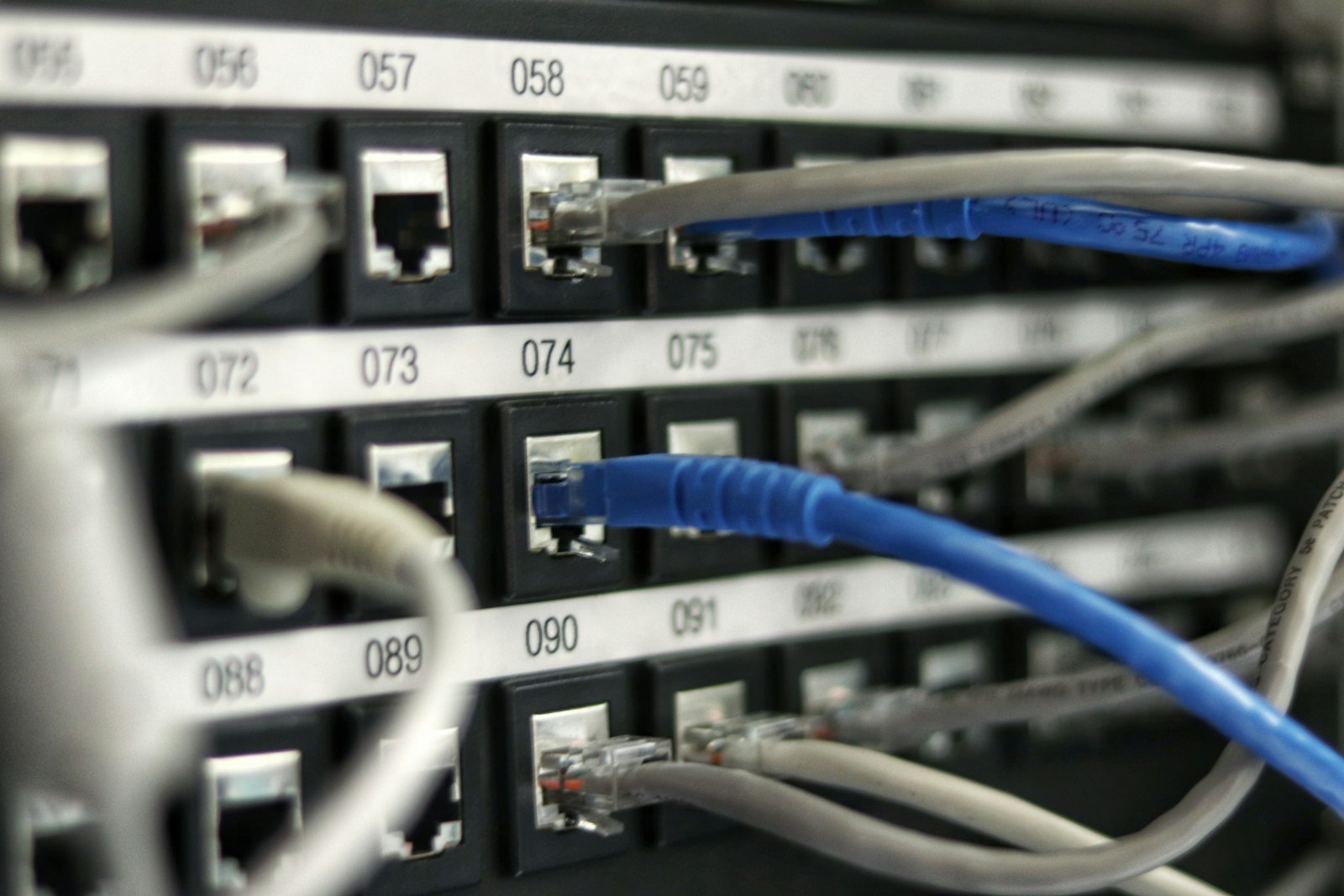 Network cables plugged into a patch panel, the kind of wired connections that can help fix weak home Wi-Fi