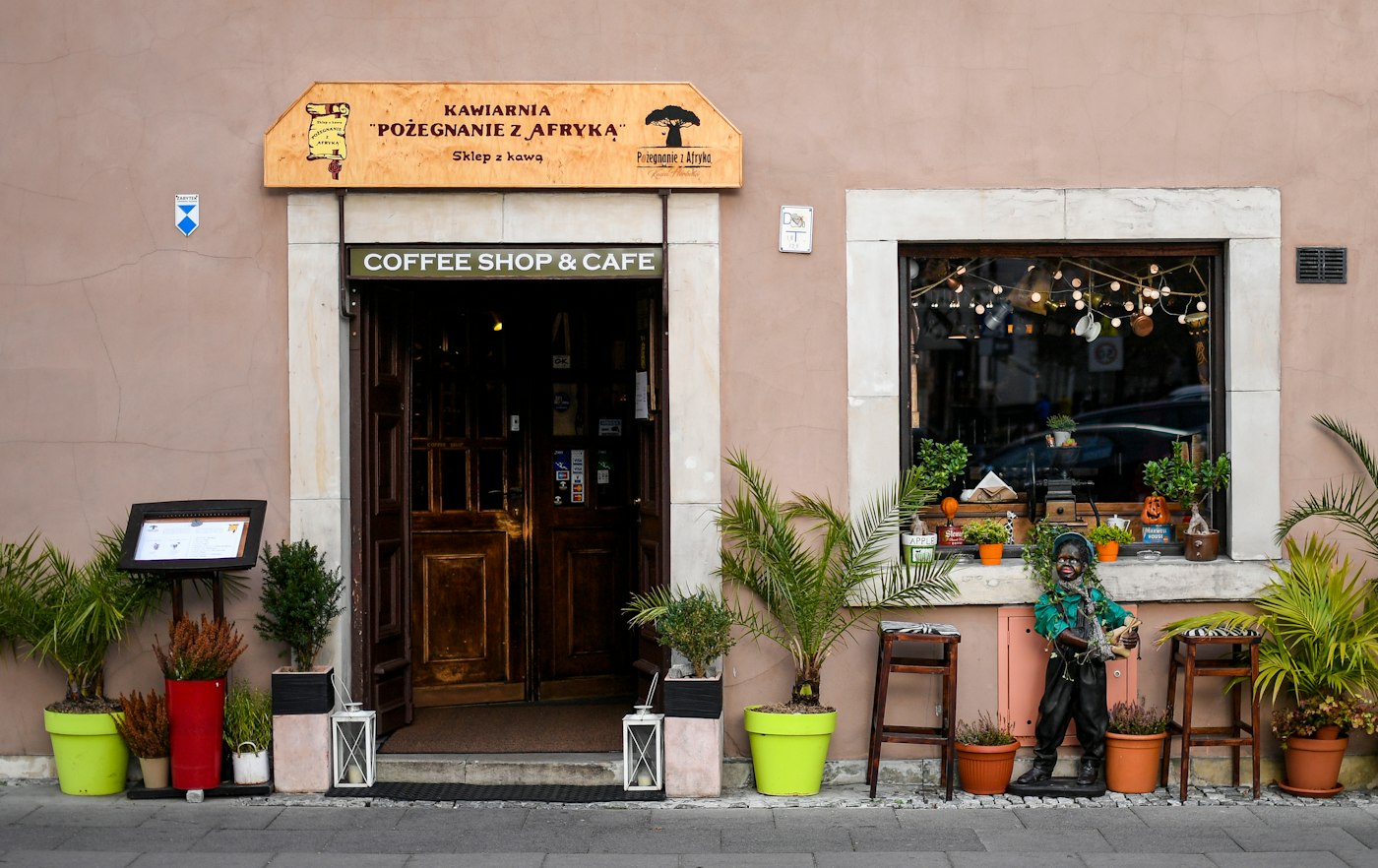 The ConnectionCafe.com storefront on Kiln Street in Shoreditch, with plants either side of the door